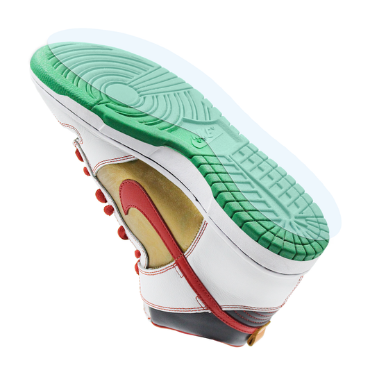 The Nike SB Dunk Sole Guard is shown on green-soled, red-accented, gold-detailed Dunks, photographed from the bottom on a white background—ideal for displaying your sneakers or protecting them with this compatible sole protector.
