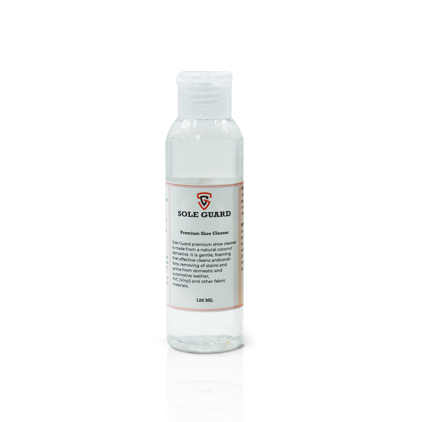 Clear bottle of Shoe Cleaning Kit with a white label and orange accents, featuring a coconut-based cleaning solution for versatile sneaker care.