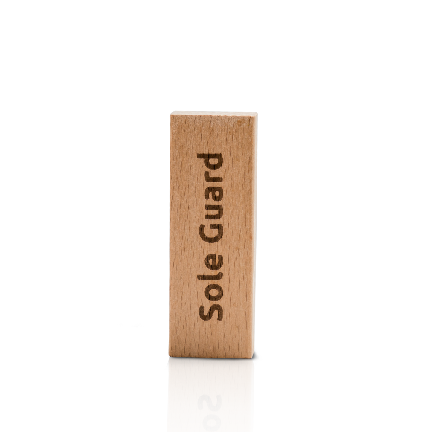 A wooden block engraved with "Sole Guard" vertically, showcased against a white background, is a feature of the Shoe Cleaning Kit.