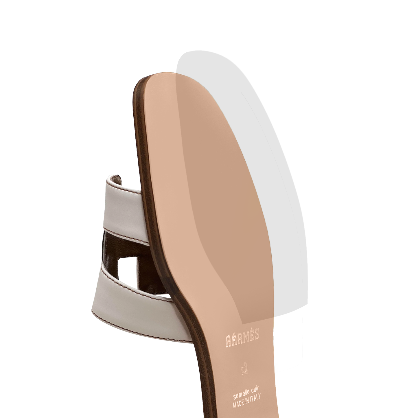 White Hermès Oran Sandal Sole Guard displayed from the side on a white background, featuring a tan base.