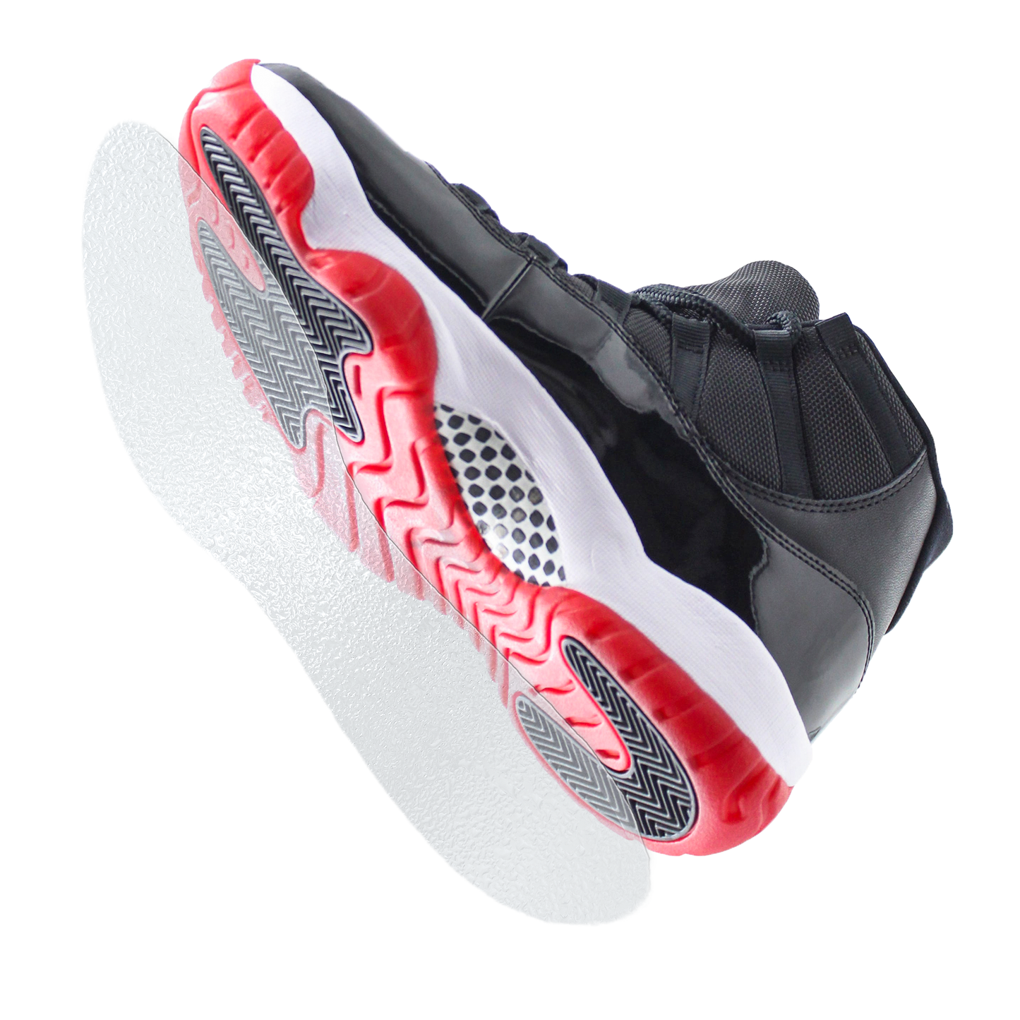The Sole Guard Jordan 11 Traction Sole Guard 3 Pack features black and red athletic sneakers shown from below, highlighting a textured pattern and sneaker sole shields for enhanced durability.