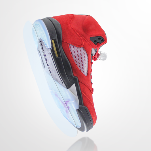 Red and black sneaker with a translucent sole, featuring a Jordan 5 Sole Guard, shown from below against a white background.