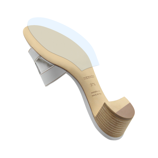 A Hermès Oasis Sandal viewed from below reveals the sole—perfect for applying the Sole Guard Hermès Oasis Sandal Sole Guard 3x Pack by Sole Guard to keep your sandals pristine and protected.