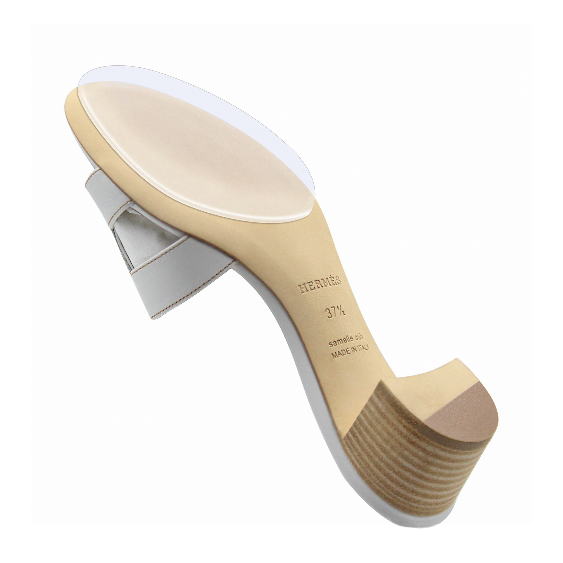 White Hermès Oasis Sandal with a wooden sole and clear strap, seen from below, highlighting its elegance. An invisible Sole Guard from the Hermès Oasis Sandal Sole Guard 3x Pack ensures durability and protection.