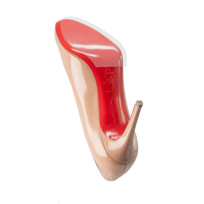 A beige high-heeled shoe featuring a distinct red sole, similar to the Christian Louboutin Pumps Sole Guard 3x Pack, viewed from underneath.