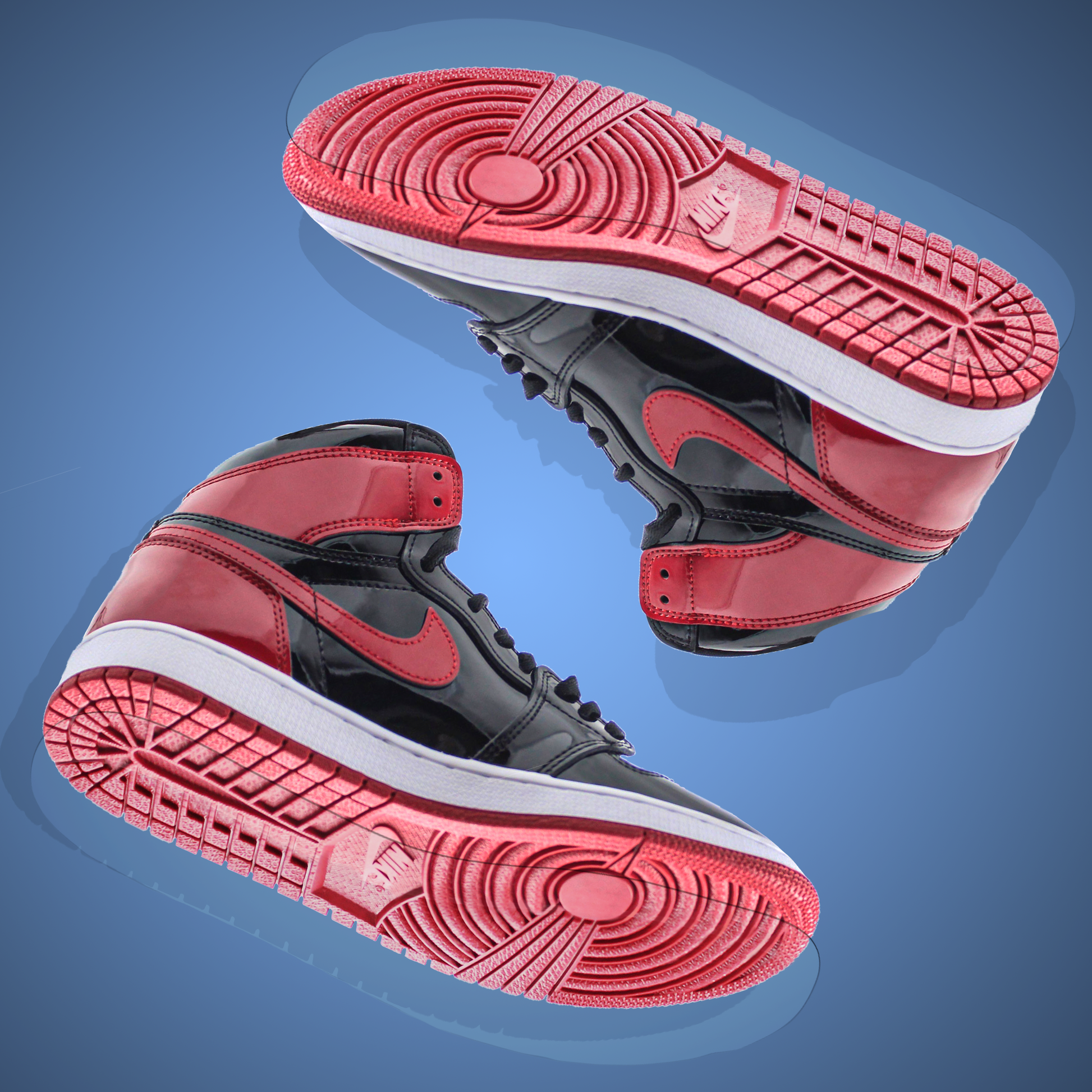 Two black and red high-top sneakers with unique tread patterns, now enhanced with the Jordan 1 Sole Guard for added protection, set against a blue background.