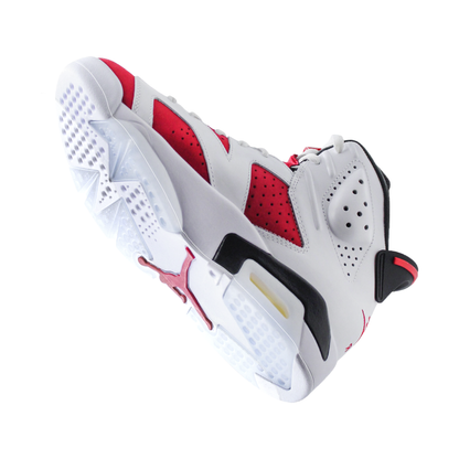 The Jordan 6 Sole Guard is a white and red basketball shoe with black accents, featuring a detailed sole design and perforated upper panels, equipped with a protective Vinyl Polymer sole protector.