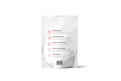 The Shoe Cleaning Kit comes in a white resealable pouch with icons and text, featuring a versatile coconut-based cleaner. It includes a synthetic bristle brush for diverse surfaces such as sneakers. A barcode at the bottom facilitates easy inventory tracking.